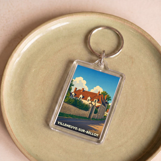 Porte-clés souvenir de la ville de Villeneuve-sur-Bellot avec une illustration stylisée.