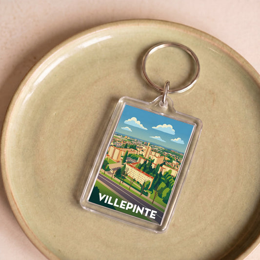 Porte-clés souvenir de la ville de Villepinte avec une illustration stylisée.