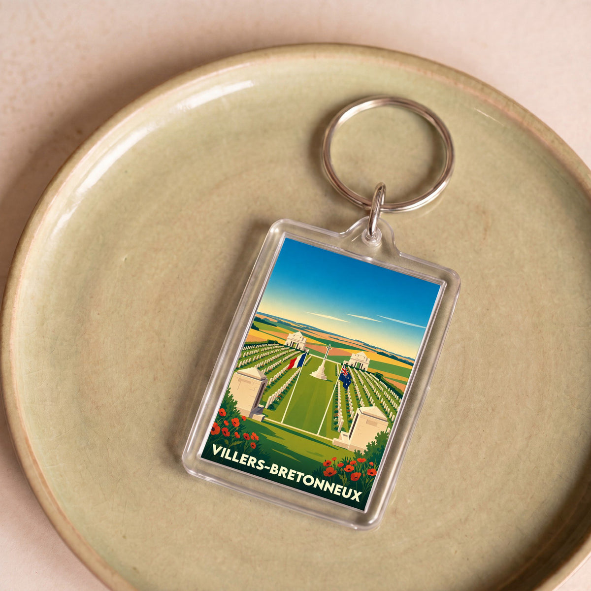 Porte-clés souvenir de la ville de Villers-Bretonneux avec une illustration stylisée de son mémorial.