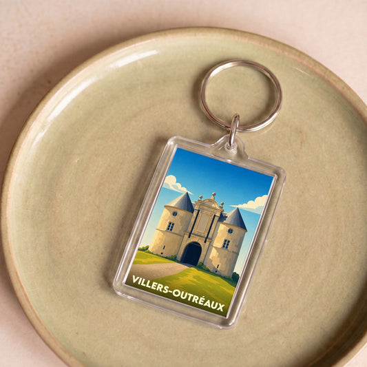 Porte-clés souvenir de la ville de Villers-Outréaux avec une illustration stylisée de son château.