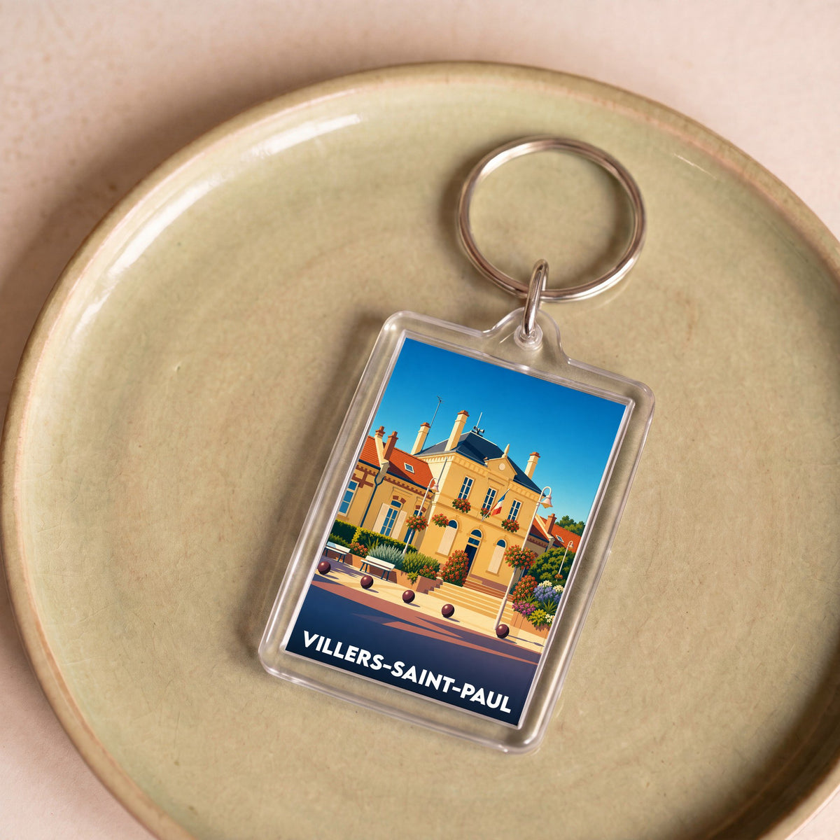 Porte-clés souvenir de la ville de Villers-Saint-Paul avec une illustration stylisée de l'hôtel de ville.