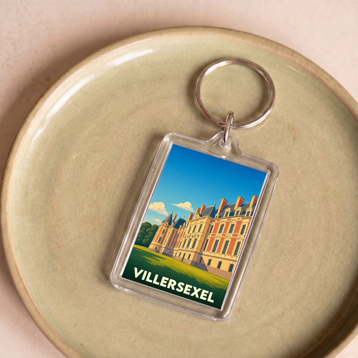 Porte-clés souvenir de la ville de Villersexel avec une illustration stylisée de son château.