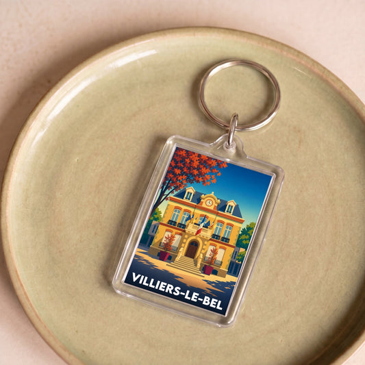 Porte-clés souvenir de la ville de Villiers-le-Bel avec une illustration stylisée et colorée.