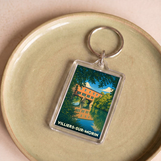 Porte-clés souvenir de la ville de Villiers-sur-Morin avec une illustration stylisée.