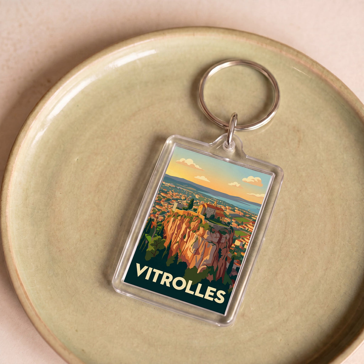 Porte-clés souvenir de la ville de Vitrolles avec une illustration stylisée.
