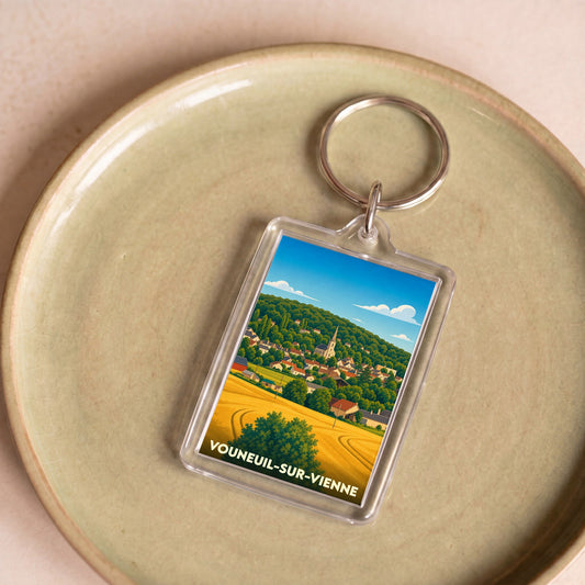 Porte-clés souvenir de la ville de Vouneuil-sur-Vienne avec une illustration stylisée.