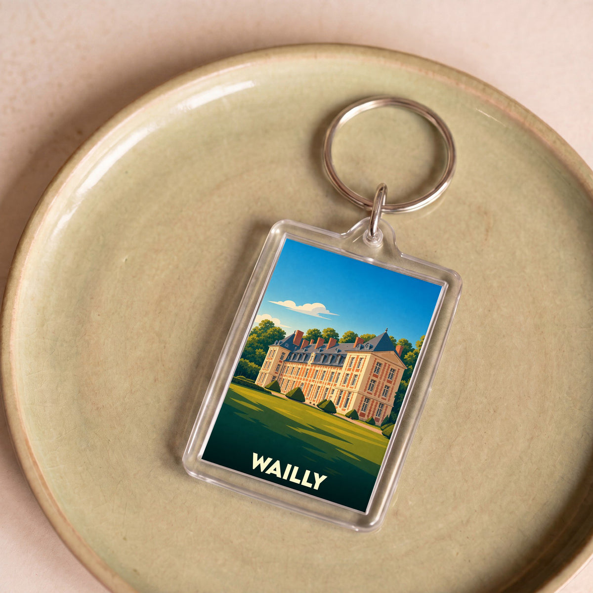 Porte-clés souvenir de la ville de Wailly avec une illustration stylisée d'un château.