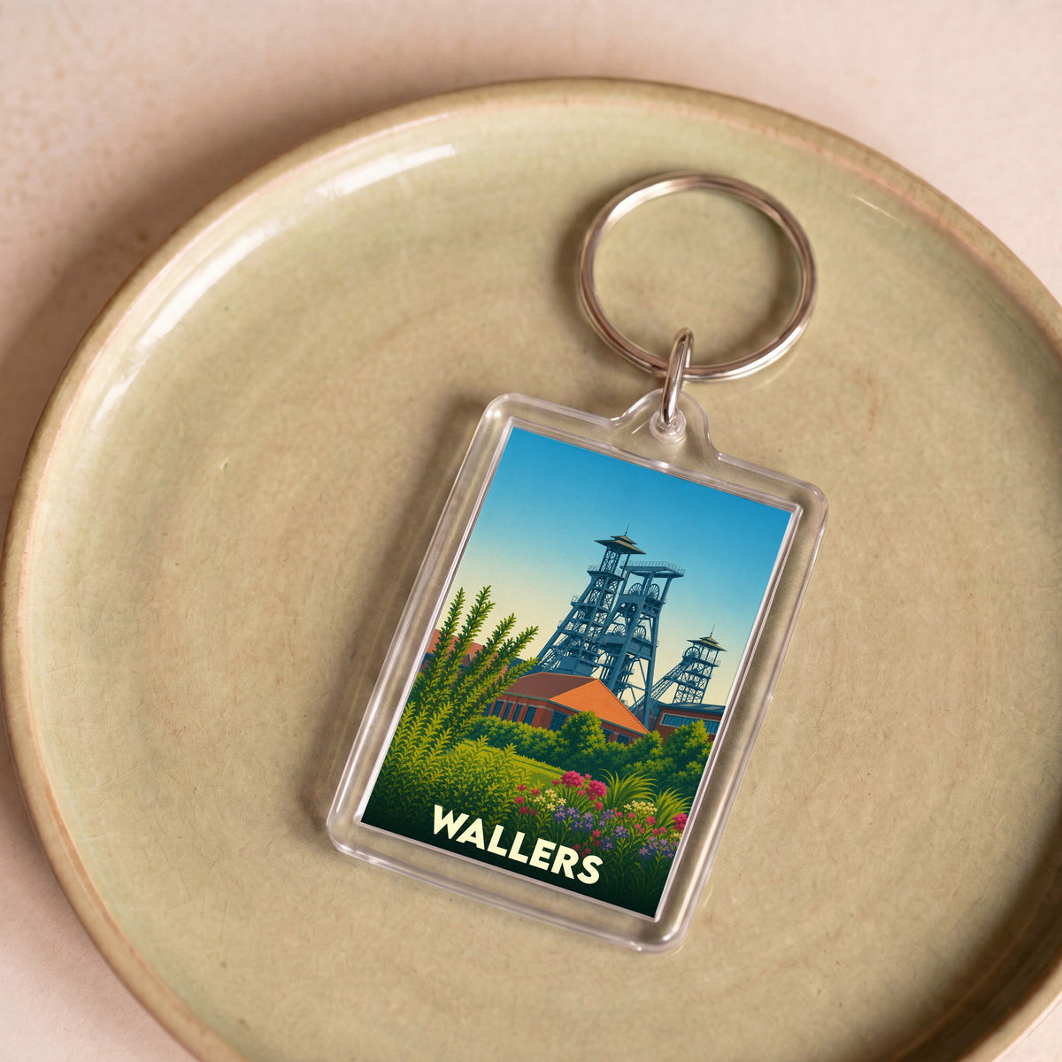 Porte-clés souvenir de la ville de Wallers avec une illustration stylisée de ses anciens chevalements miniers.