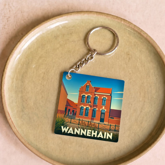 Porte-clés souvenir de la ville de Wannehain avec une illustration stylisée.