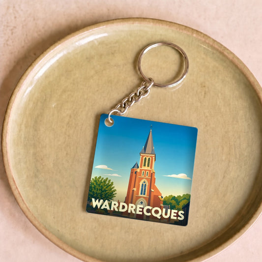 Porte-clés souvenir de la ville de Wardrecques avec une illustration stylisée de son église.