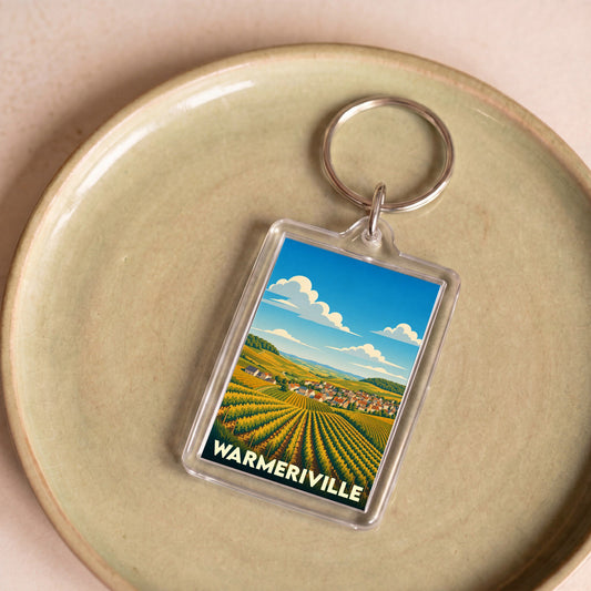 Porte-clés souvenir de la ville de Warmeriville avec une illustration stylisée de vignobles.