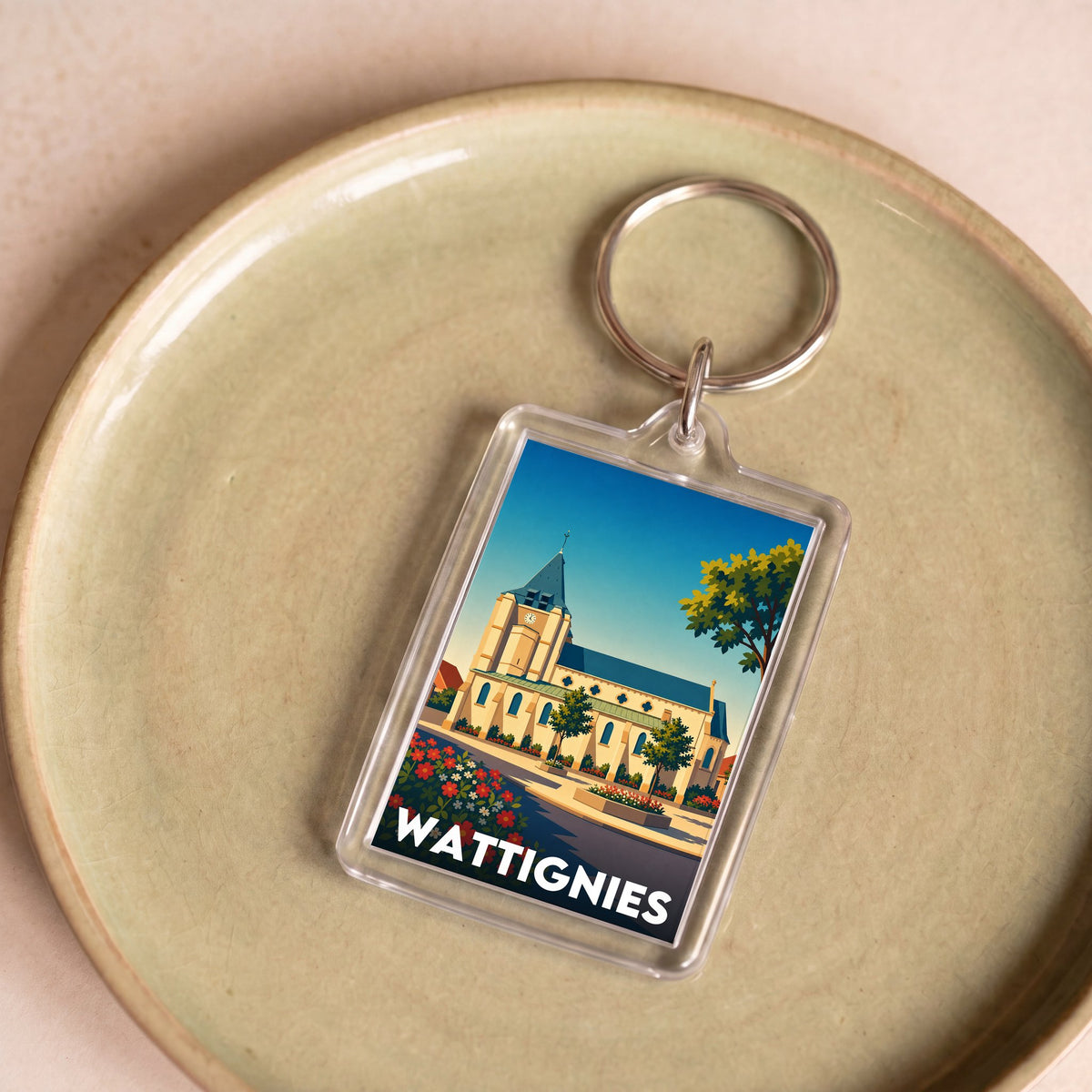 Porte-clés souvenir de la ville de Wattignies avec une illustration stylisée de son église.