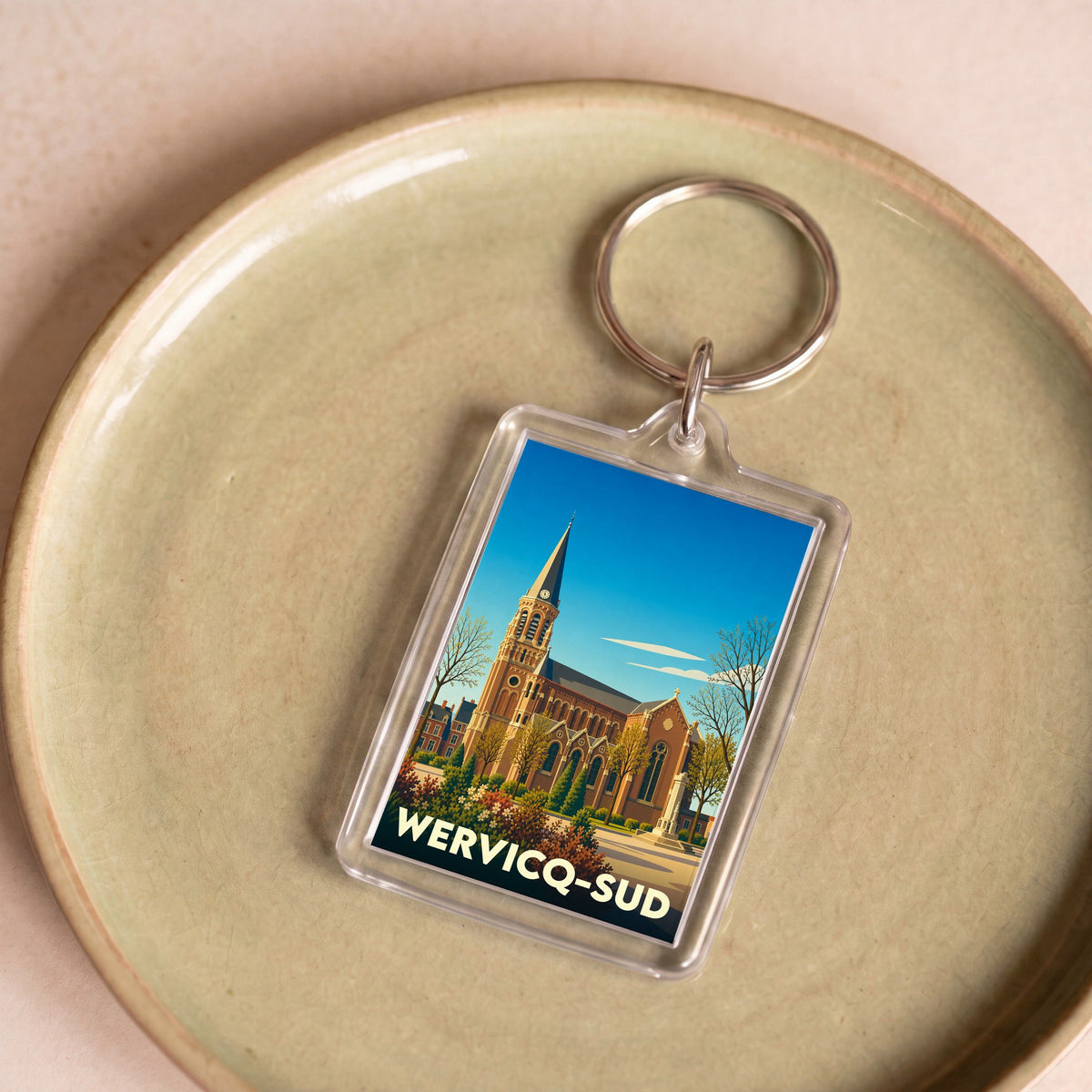 Porte-clés souvenir de la ville de Wervicq-Sud avec une illustration stylisée de son église.