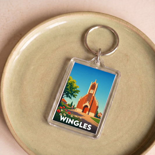 Porte-clés souvenir de la ville de Wingles avec une illustration stylisée de son église.