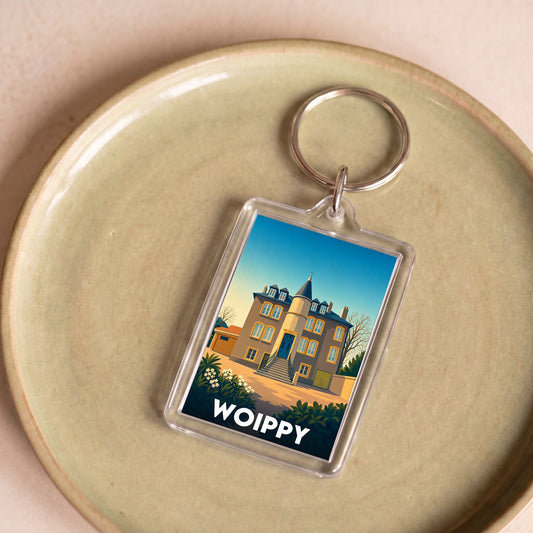 Porte-clés souvenir de la ville de Woippy avec une illustration stylisée.