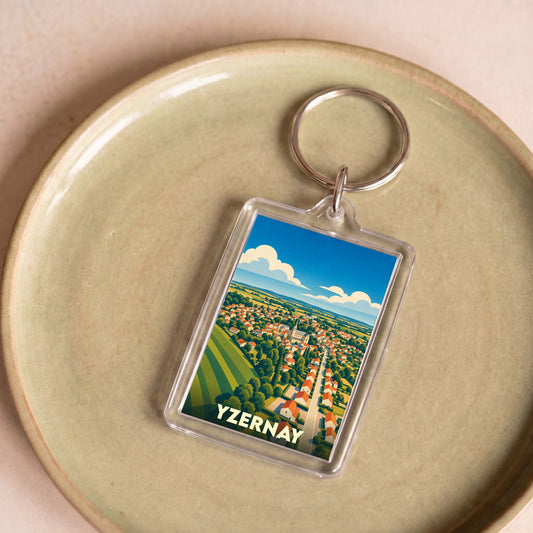 Porte-clés souvenir de la ville d'Yzernay avec une illustration stylisée.
