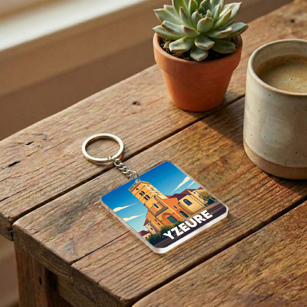 Porte-clés souvenir de la ville d'Yzeure avec une illustration stylisée.