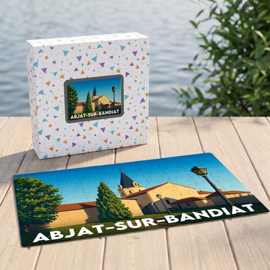 Puzzle souvenir de la ville de Abjat-sur-Bandiat avec une illustration stylisée et sa boîte assortie.