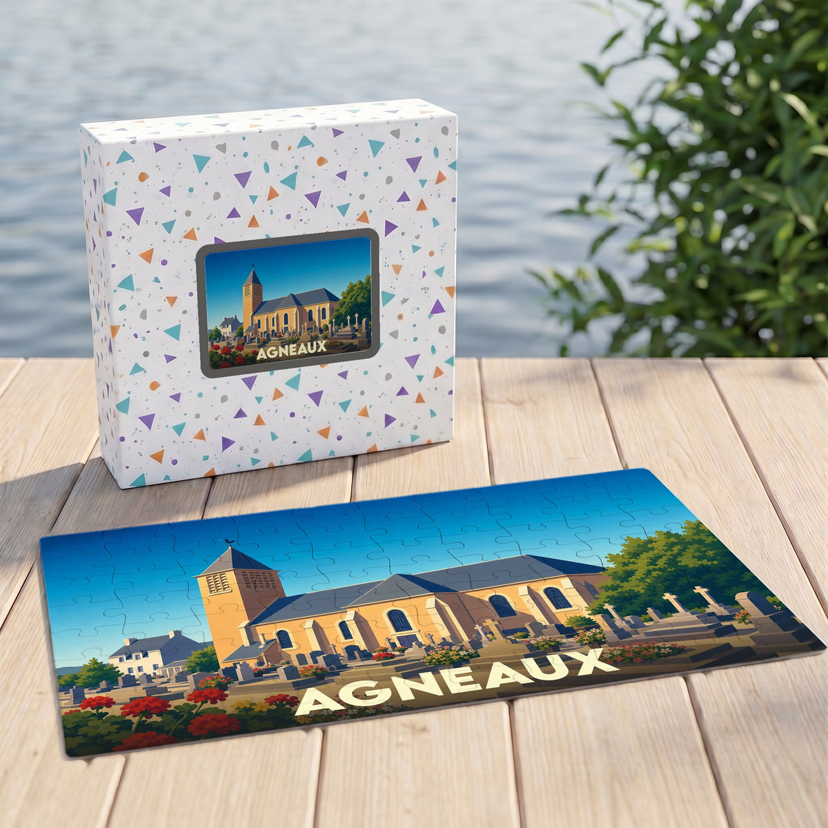 Puzzle souvenir de la ville d'Agneaux représentant son église et son cimetière avec une illustration stylisée.