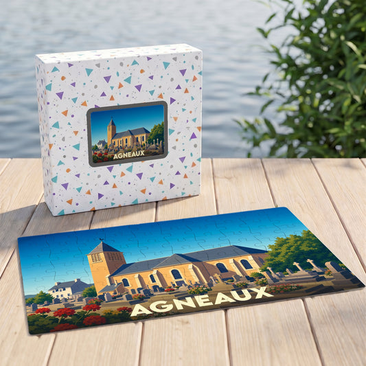 Puzzle souvenir de la ville d'Agneaux représentant son église et son cimetière avec une illustration stylisée.