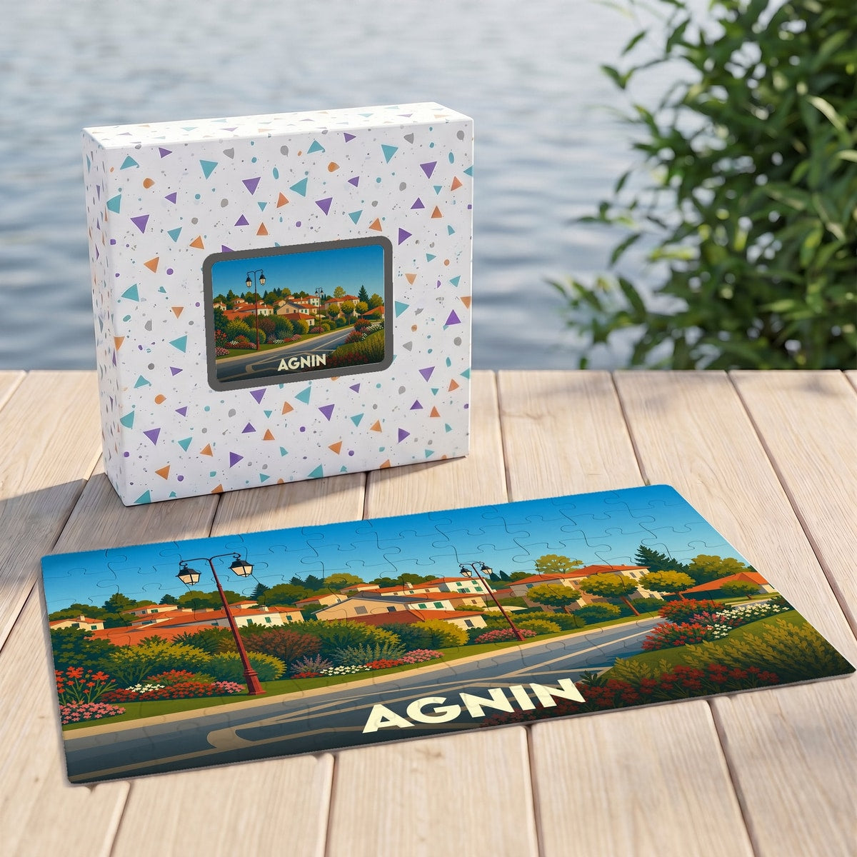 Puzzle souvenir de la ville d'Agnin avec une illustration stylisée de ses paysages.