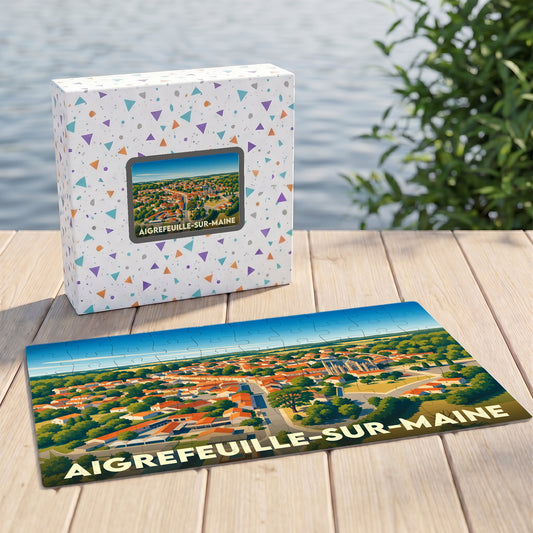 Puzzle souvenir de la ville d'Aigrefeuille-sur-Maine avec une illustration stylisée vue du ciel.