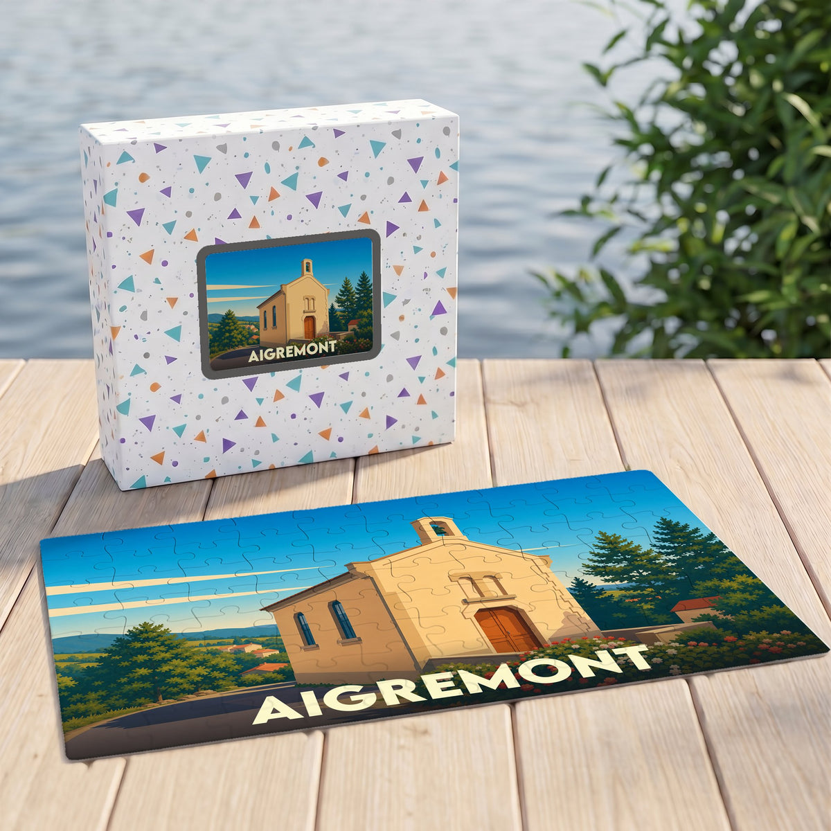 Puzzle souvenir de la ville d'Aigremont avec une illustration stylisée d'une chapelle.