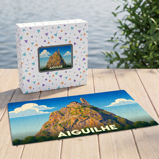 Puzzle souvenir de la ville d'Aiguilhe représentant son rocher et sa chapelle avec une illustration stylisée.