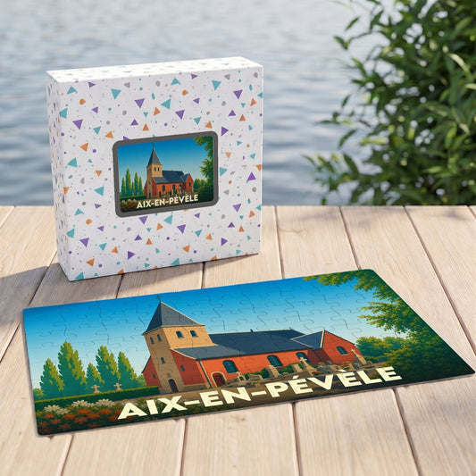 Puzzle souvenir de la ville d'Aix-en-Pévèle avec une illustration stylisée d'une église, présenté devant sa boîte.