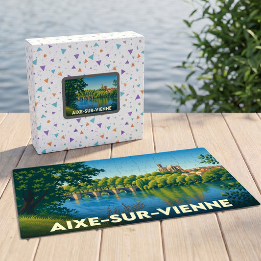 Puzzle souvenir de la ville de Aixe-sur-Vienne avec une illustration stylisée d'un pont et de son église au bord de l'eau.