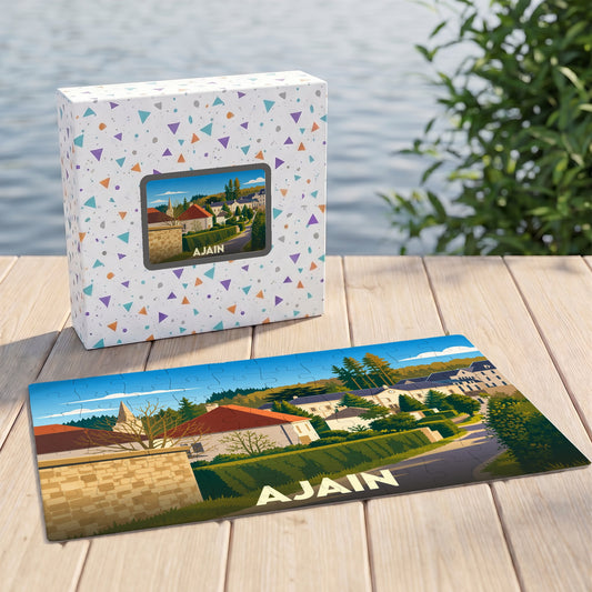 Puzzle souvenir de la ville d'Ajain avec une illustration stylisée d'un paysage urbain verdoyant.
