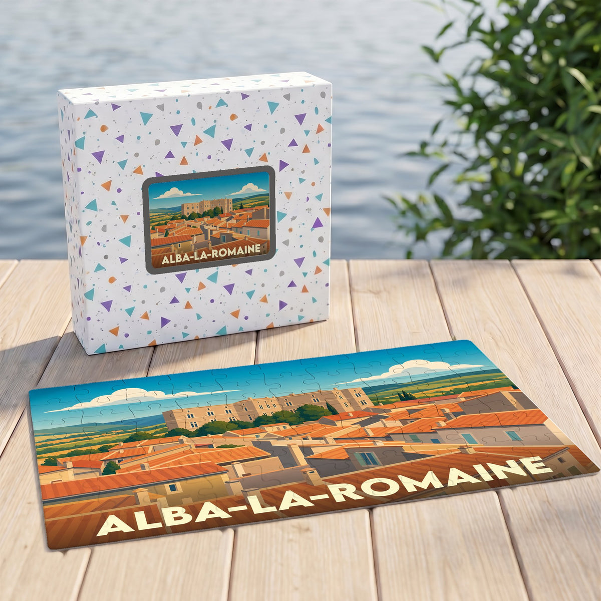 Puzzle souvenir de la ville de Alba-la-Romaine avec une illustration stylisée de ses toits et de son château.