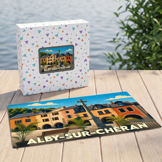 Puzzle souvenir de la ville d'Alby-sur-Chéran avec une illustration colorée et stylisée de ses bâtiments historiques.
