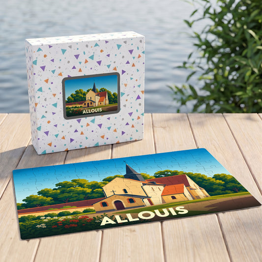 Puzzle souvenir de la ville d'Allouis représentant son église dans un style illustré, posé à côté de sa boîte.