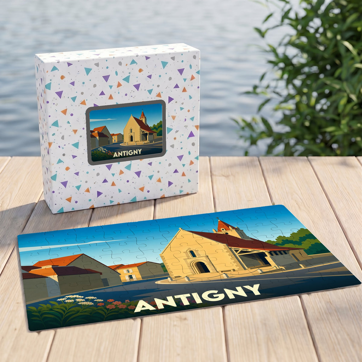 Puzzle souvenir de la ville d'Antigny avec une illustration stylisée d'une église.
