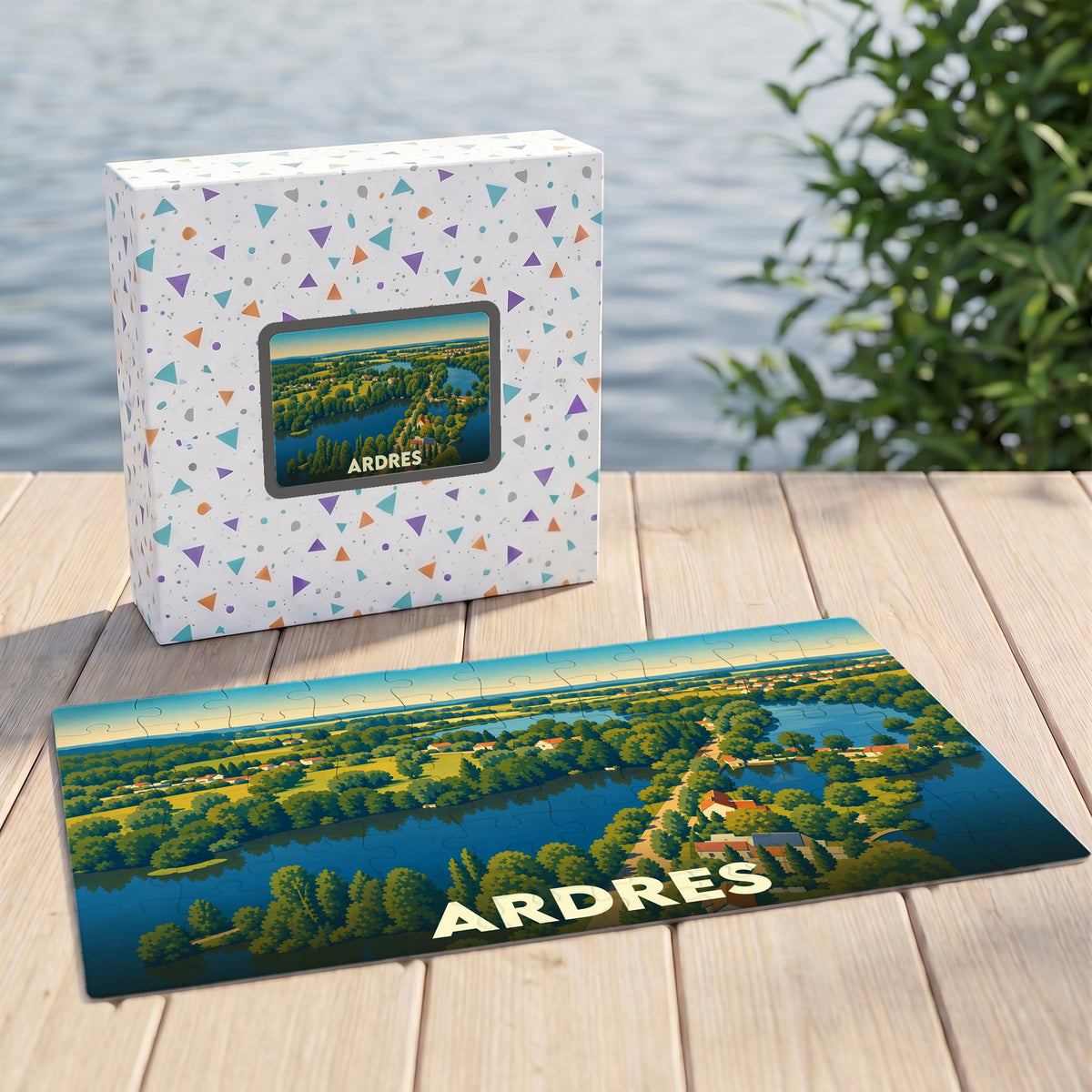Puzzle souvenir de la ville d'Ardres avec une illustration de paysage lacustre stylisée.