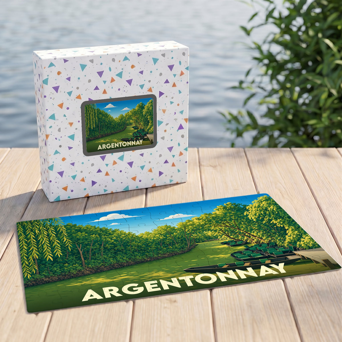 Puzzle souvenir de la ville d'Argentonnay avec une illustration stylisée d'un paysage de rivière et de barques.