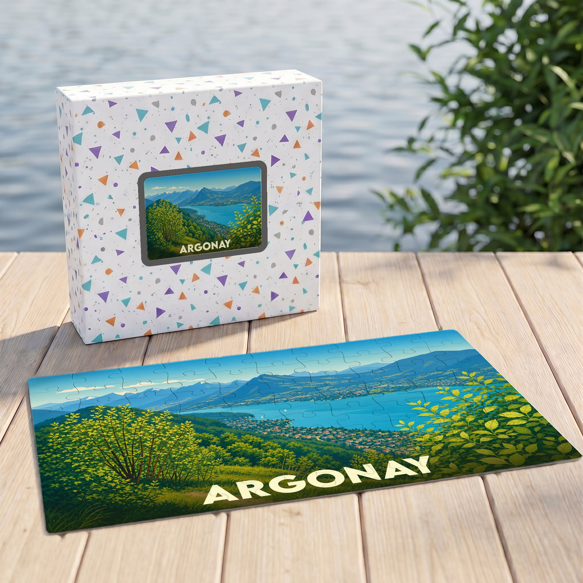 Puzzle souvenir de la ville d'Argonay représentant un paysage panoramique sur son coffret et une illustration stylisée.