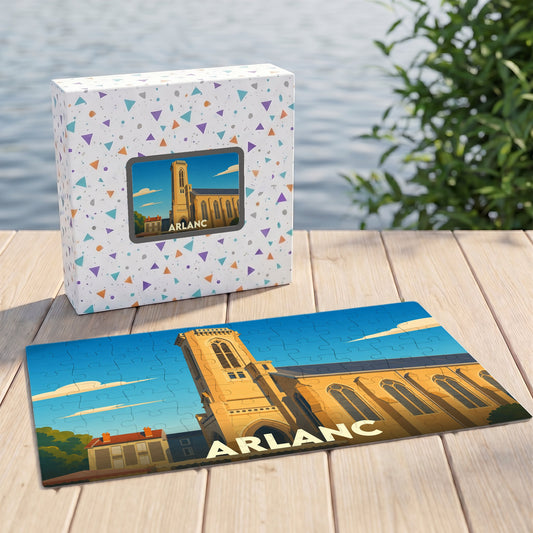 Puzzle souvenir de la ville d'Arlanc illustré par une vue stylisée de son église sous un ciel bleu.