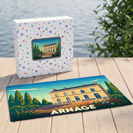 Puzzle souvenir de la ville d'Arnage avec une illustration stylisée d'une demeure classique et son coffret assorti.