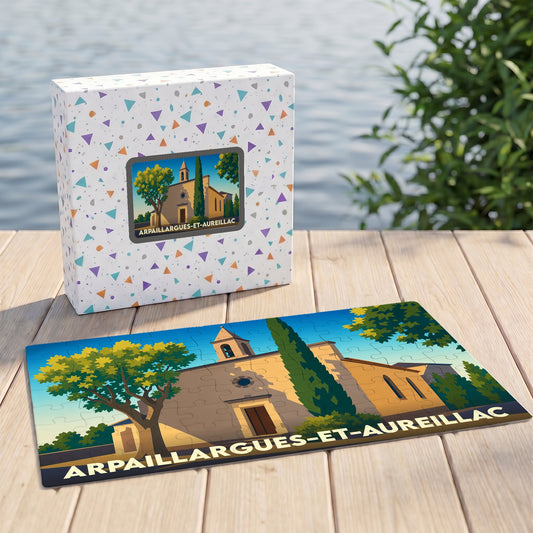 Puzzle souvenir de la ville de Arpaillargues-et-Aureillac illustrant une église provençale sous un ciel bleu.