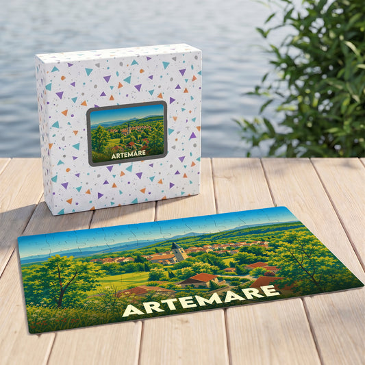 Puzzle souvenir de la ville d'Artemare illustrant un paysage verdoyant sur sa boîte et ses pièces assemblées.