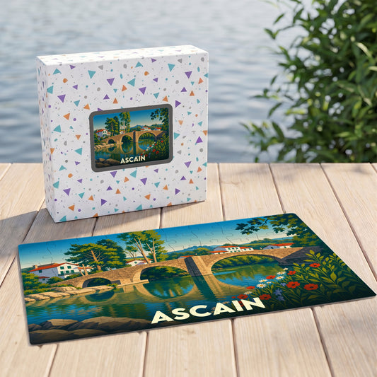 Puzzle souvenir de la ville d'Ascain avec une illustration stylisée d'un pont en pierre.