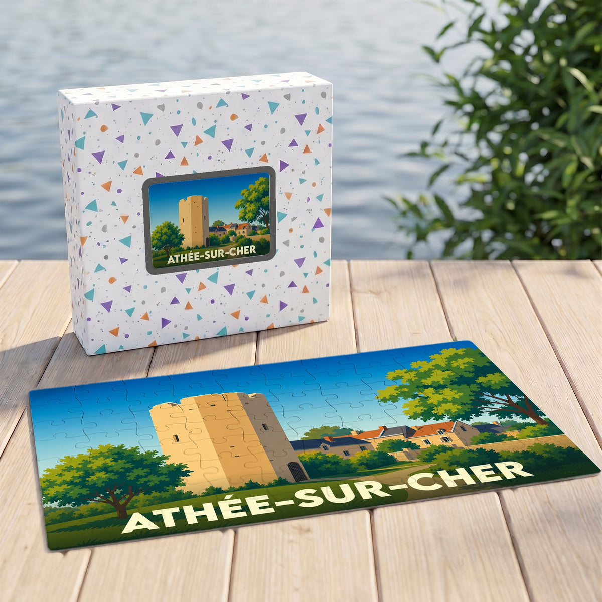 Puzzle souvenir de la ville de Athée-sur-Cher avec une illustration stylisée d'une tour historique.