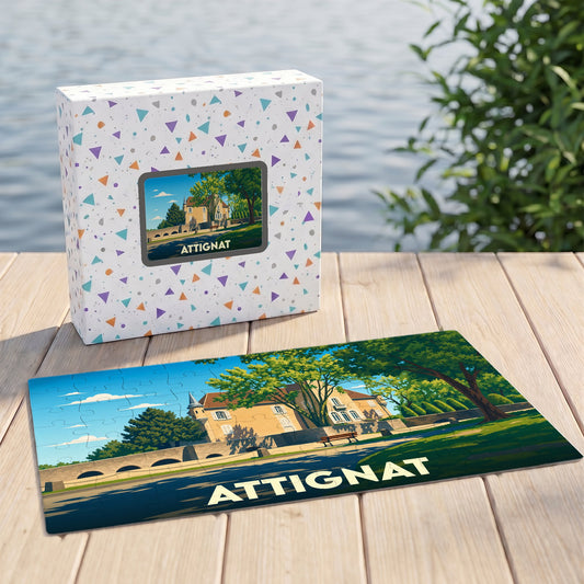 Puzzle souvenir de la ville d'Attignat présentant une illustration stylisée de son patrimoine architectural.