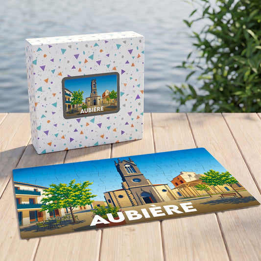 Puzzle souvenir de la ville d'Aubière avec une illustration stylisée d'une place ensoleillée.