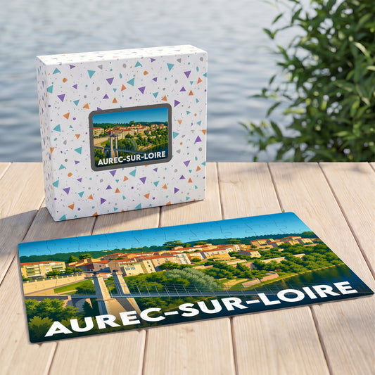 Puzzle souvenir de la ville d'Aurec-sur-Loire avec une illustration stylisée de son pont et de ses maisons en bord de fleuve.