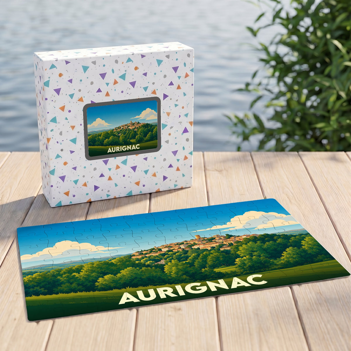 Puzzle souvenir de la ville d'Aurignac avec une illustration stylisée de son paysage vallonné.