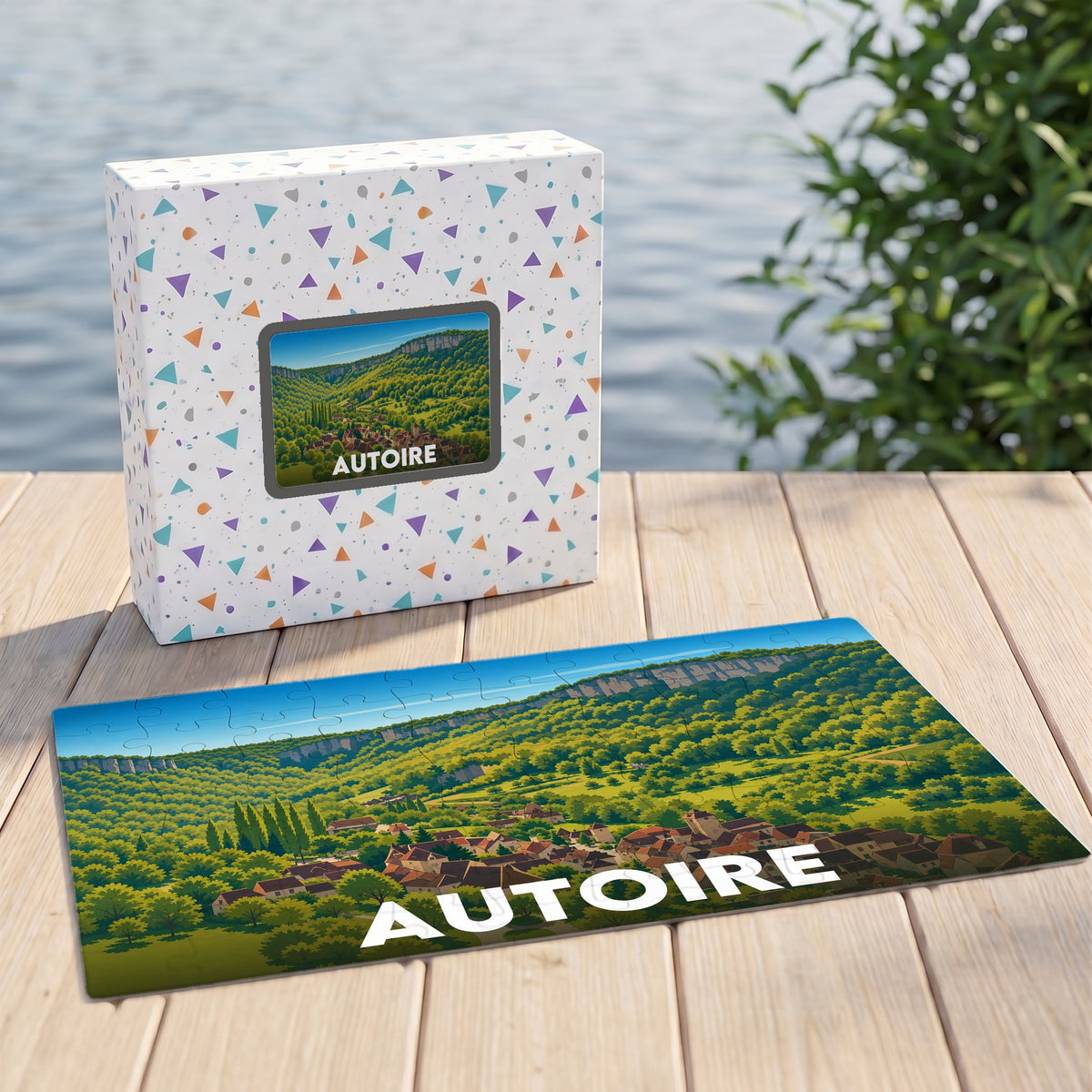 Puzzle souvenir de la ville d'Autoire avec une illustration de son paysage vallonné.