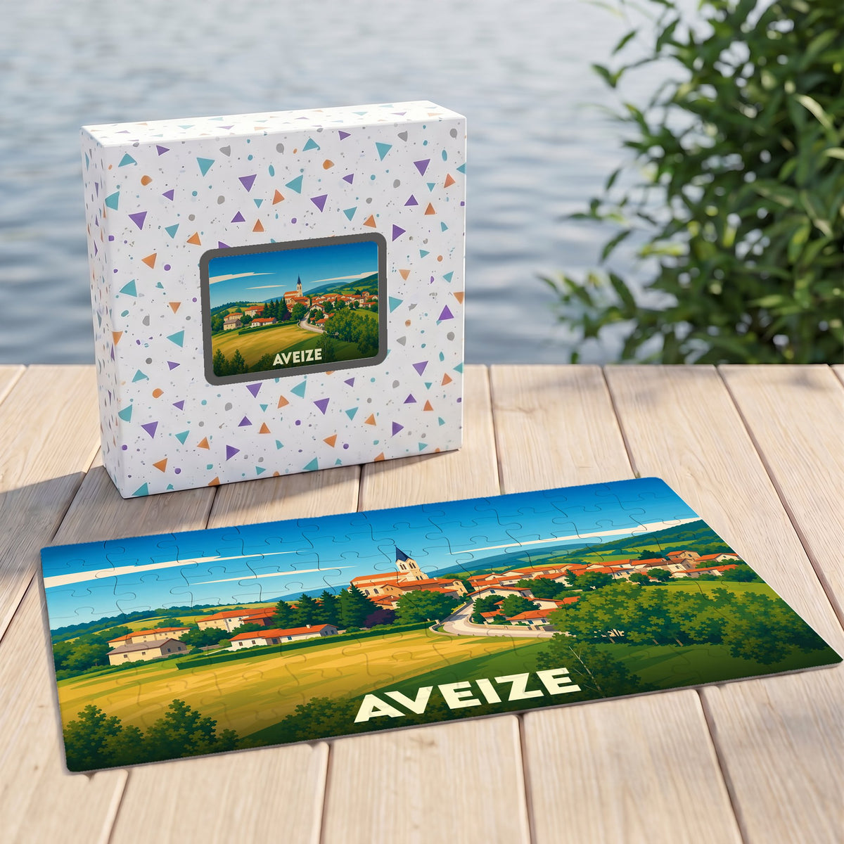 Puzzle souvenir de la ville d'Aveize avec une illustration stylisée d'un paysage de campagne.